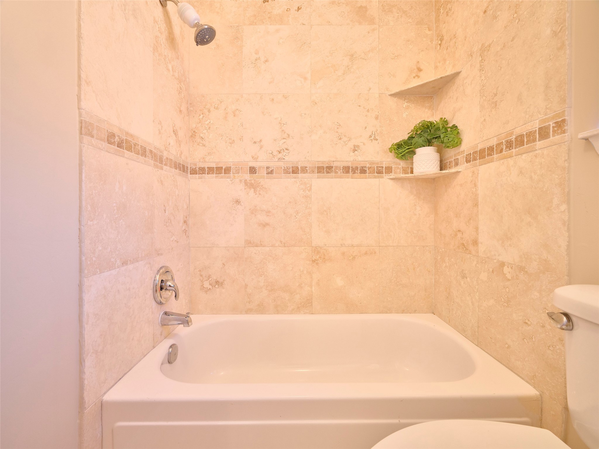 8315 Terrace Wind Lane Houston, TX 77040 - Photo 19 of 50 a bathroom with a bathtub and shower