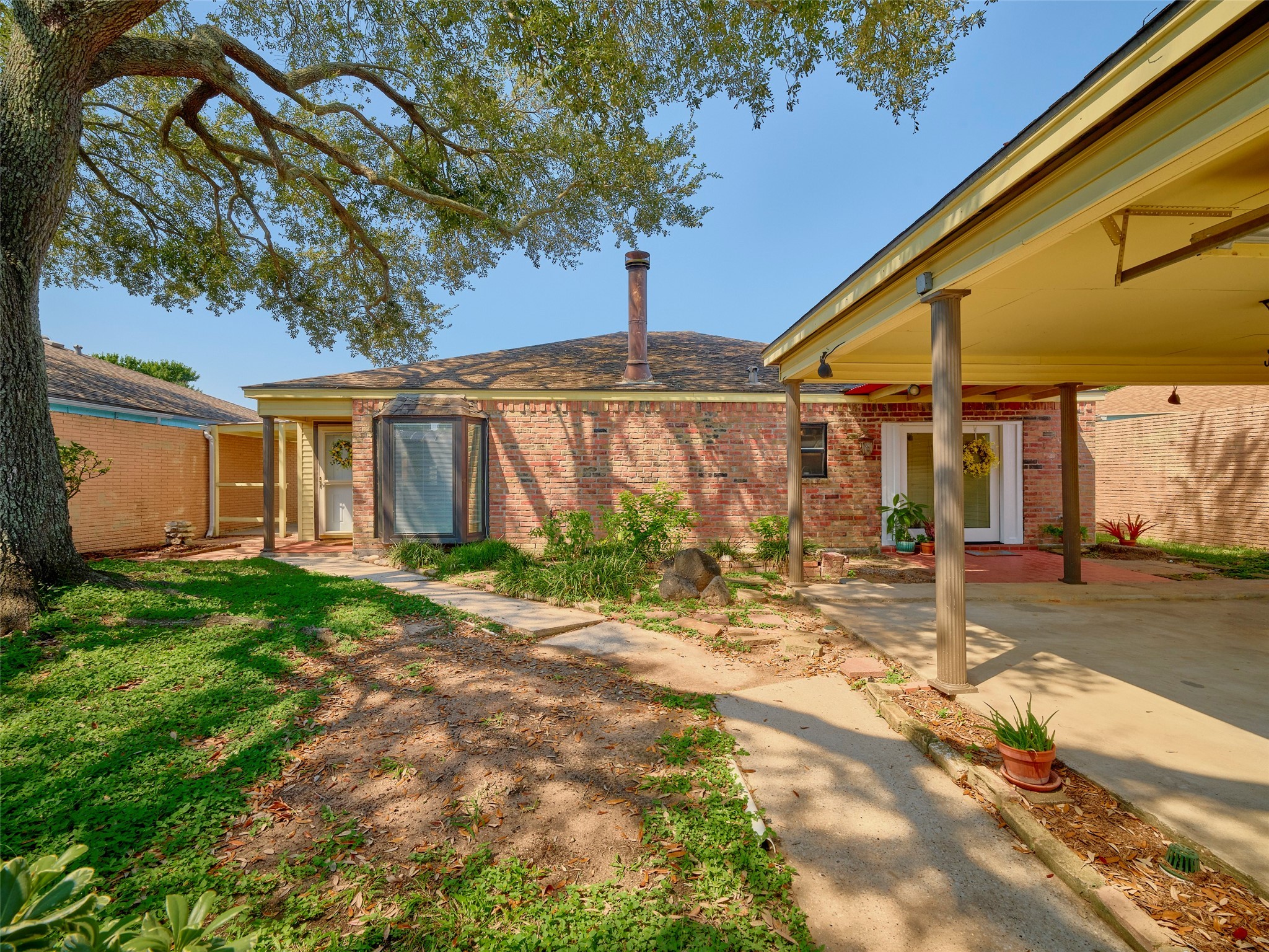 8315 Terrace Wind Lane Houston, TX 77040 - Photo 2 of 50 a view of a house with backyard and tree