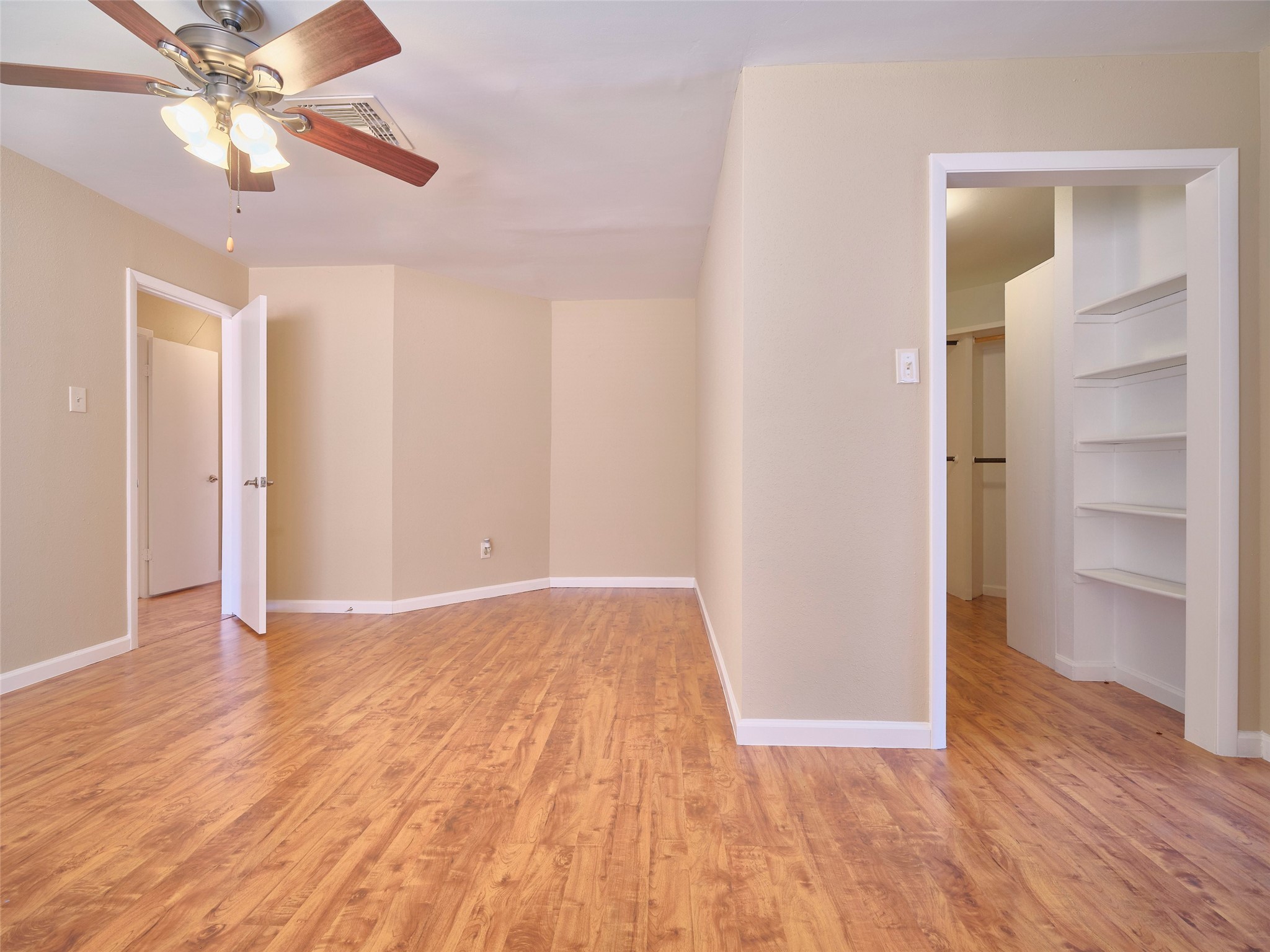 8315 Terrace Wind Lane Houston, TX 77040 - Photo 28 of 50 a view of an empty room with a window and wooden floor