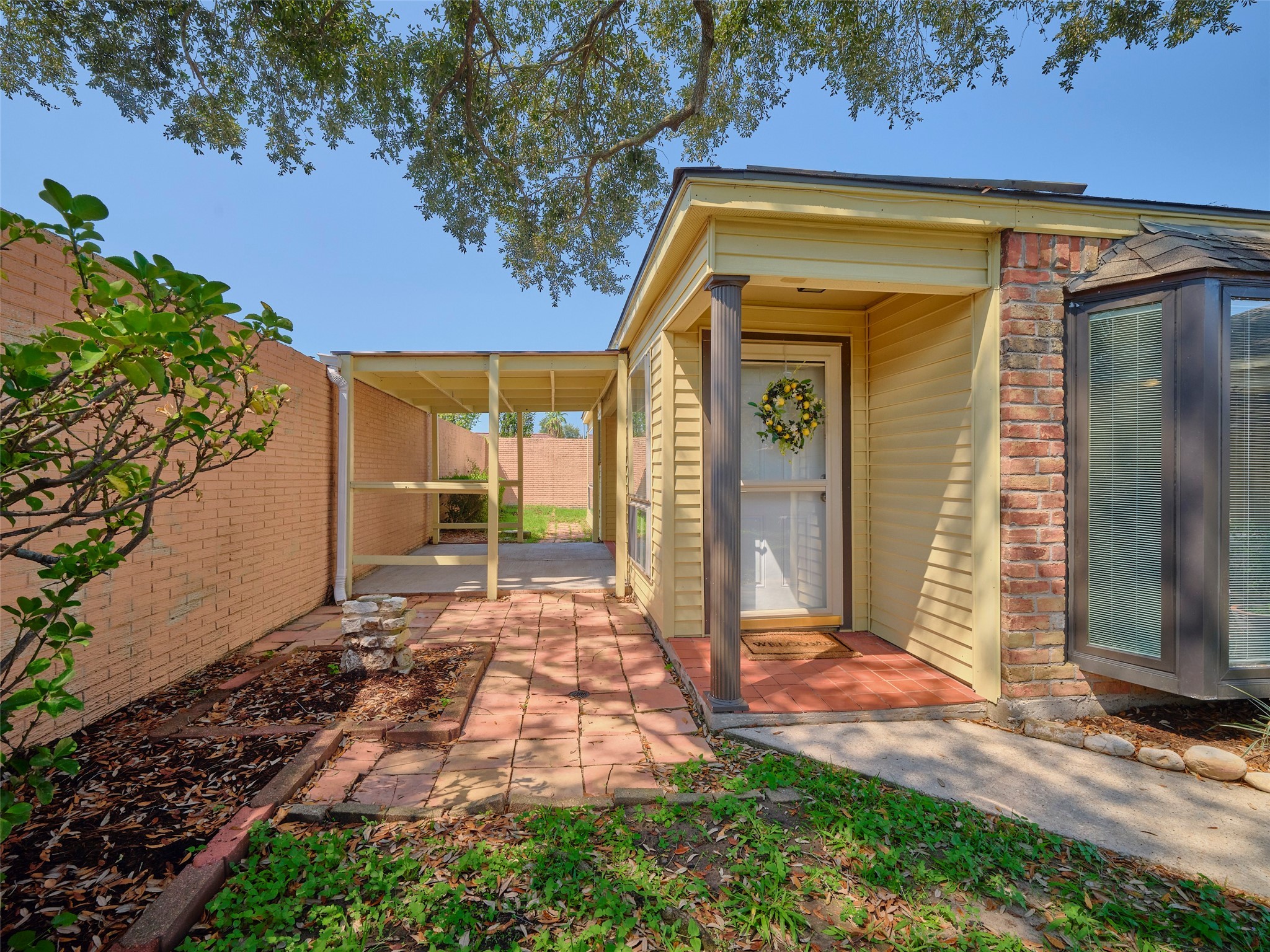 8315 Terrace Wind Lane Houston, TX 77040 - Photo 3 of 50 a front view of a house with a yard