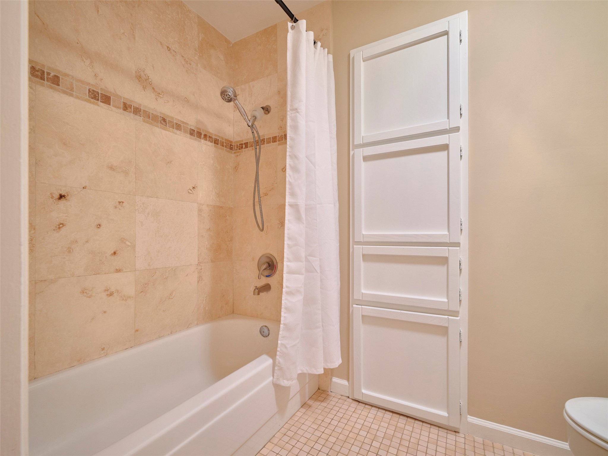 8315 Terrace Wind Lane Houston, TX 77040 - Photo 31 of 50 a bathroom with a bathtub and a shower