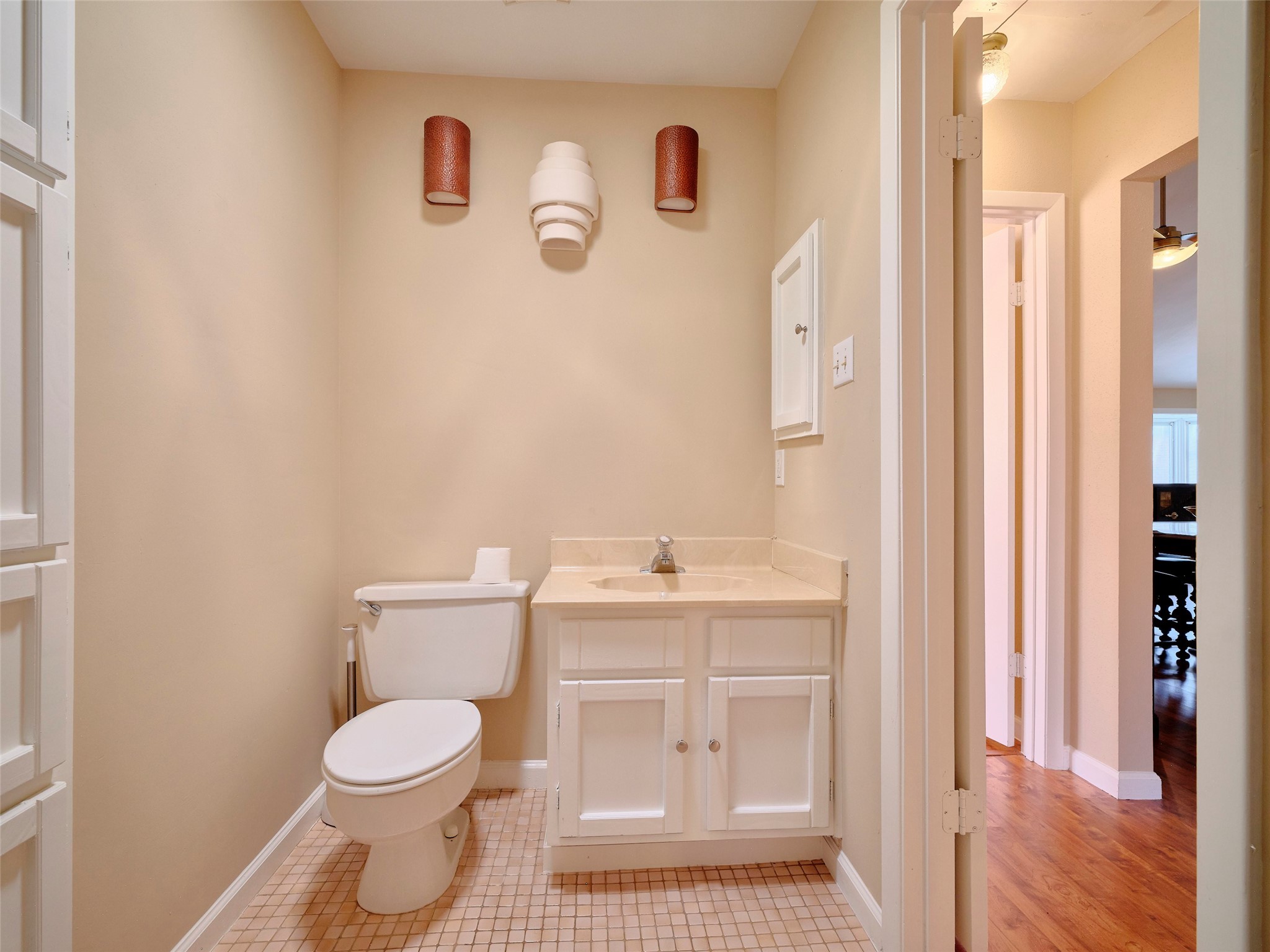 8315 Terrace Wind Lane Houston, TX 77040 - Photo 32 of 50 a bathroom with a toilet a sink and a mirror