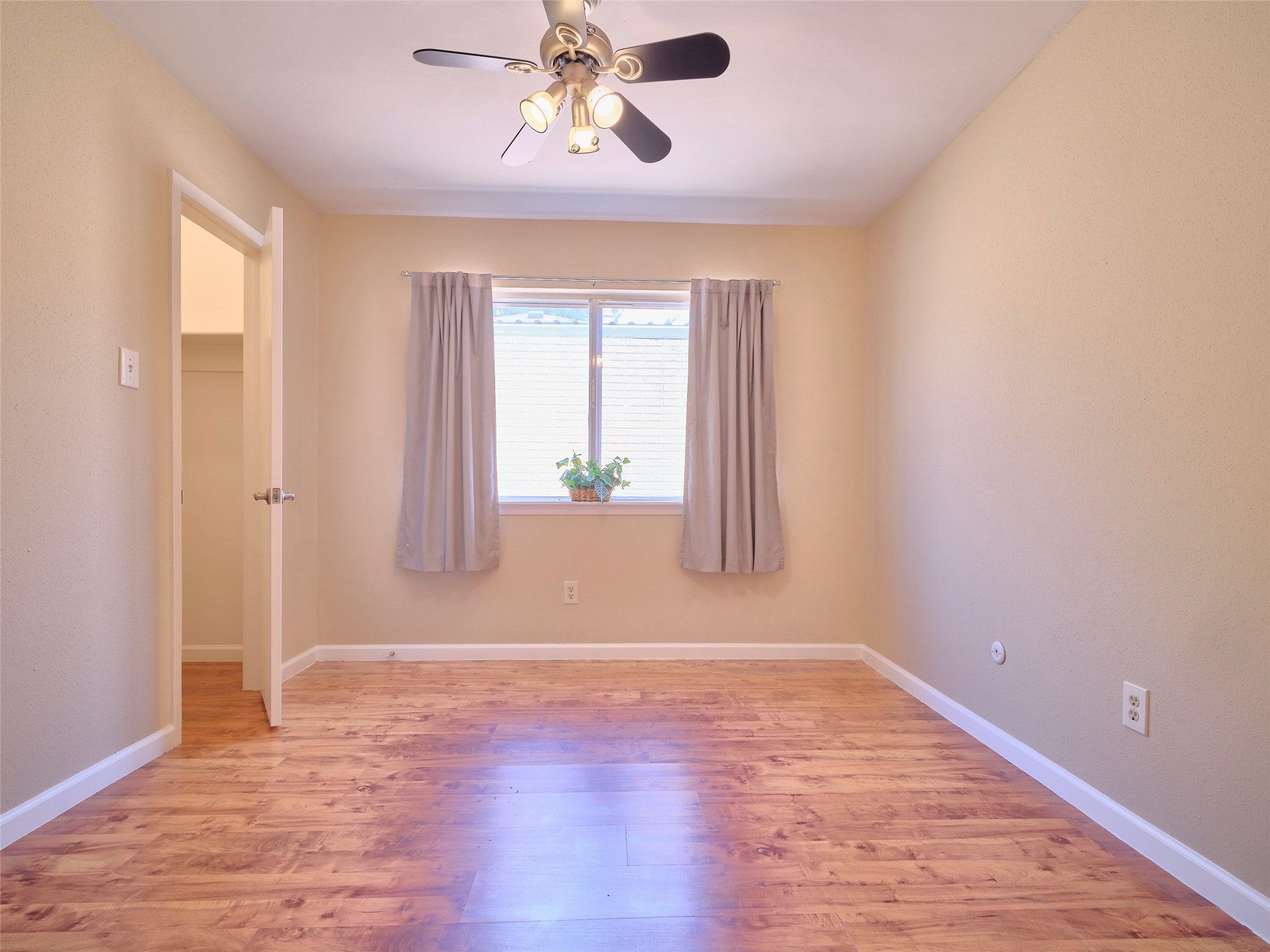 8315 Terrace Wind Lane Houston, TX 77040 - Photo 33 of 50 wooden floor in an empty room with a window
