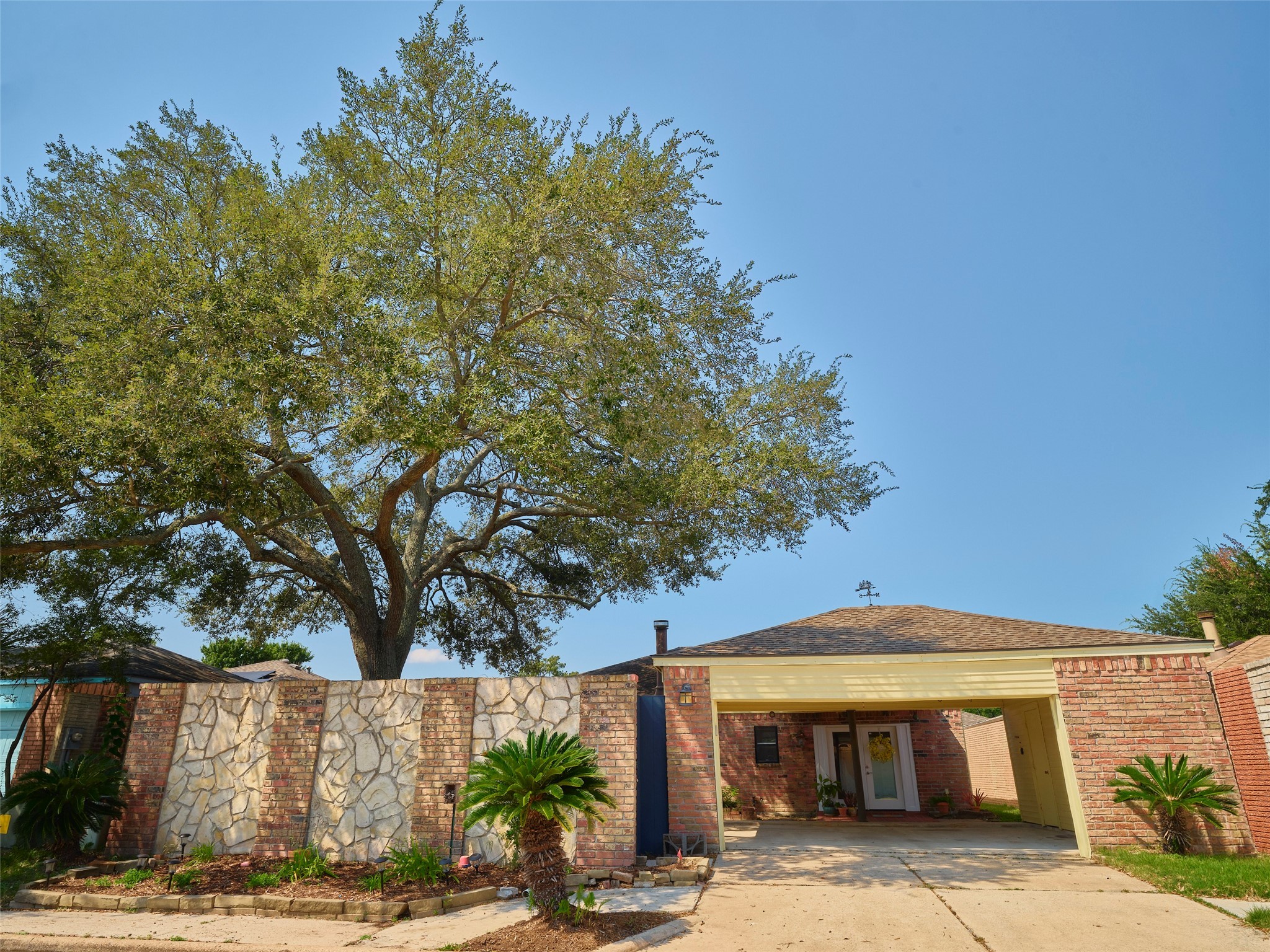 8315 Terrace Wind Lane Houston, TX 77040 - Photo 40 of 50 a front view of a house with garden