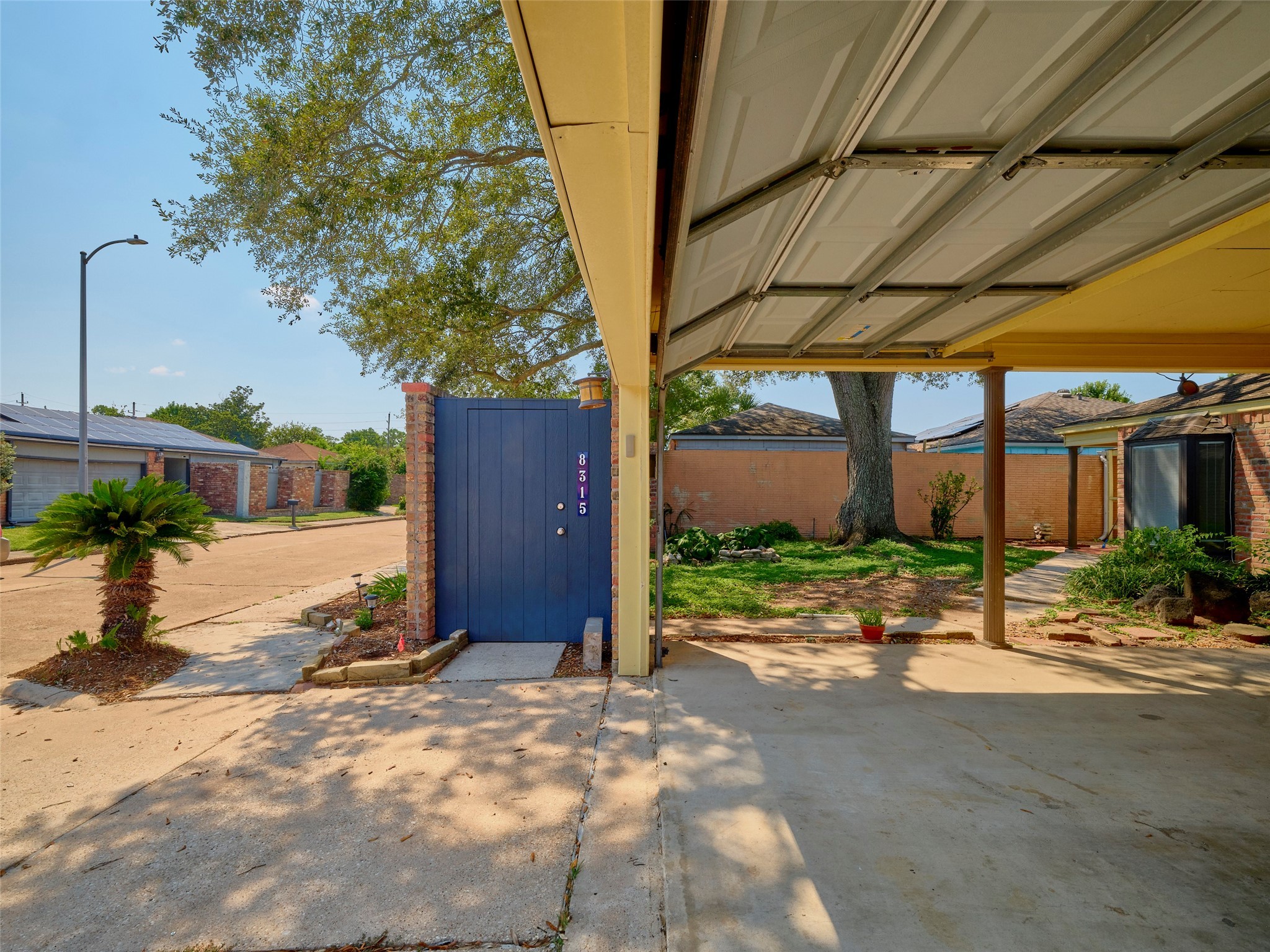 8315 Terrace Wind Lane Houston, TX 77040 - Photo 42 of 50 a view of backyard with wheel chair and potted plants