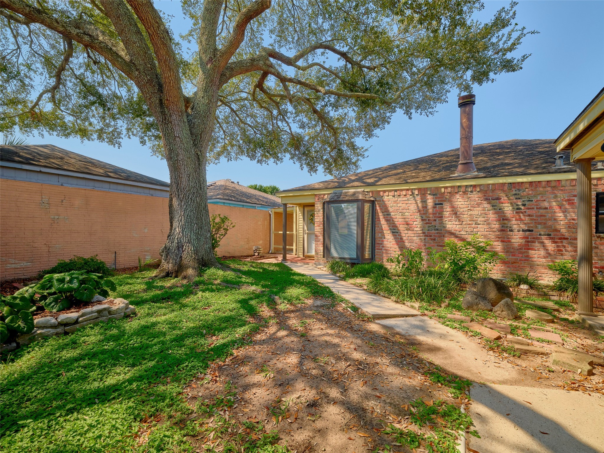 8315 Terrace Wind Lane Houston, TX 77040 - Photo 43 of 50 a front view of a house with garden