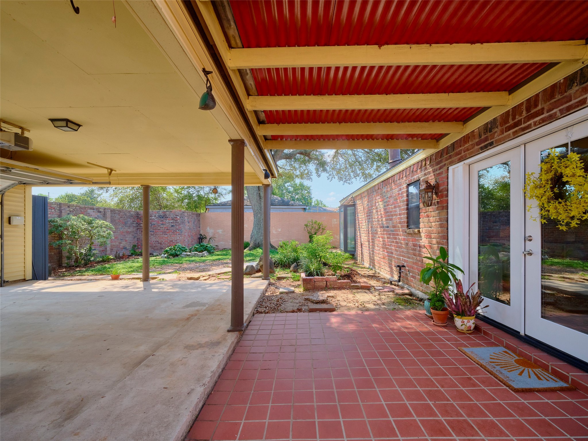 8315 Terrace Wind Lane Houston, TX 77040 - Photo 48 of 50 a view of a patio with table and chairs potted plants with wooden fence
