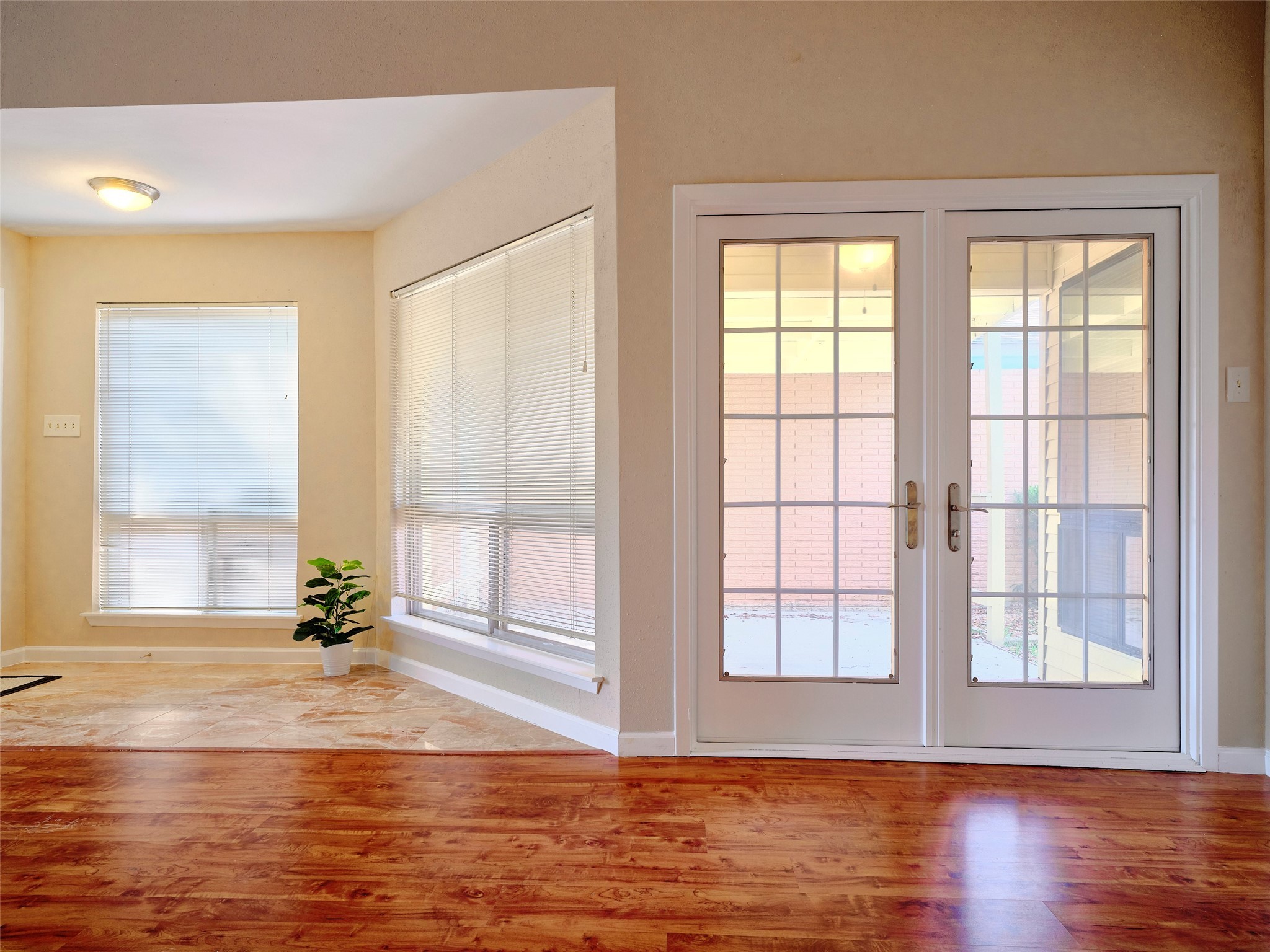 8315 Terrace Wind Lane Houston, TX 77040 - Photo 10 of 50 a view of empty room with wooden floor and fan