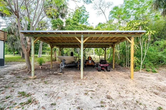 a view of balcony with wooden floor and fence