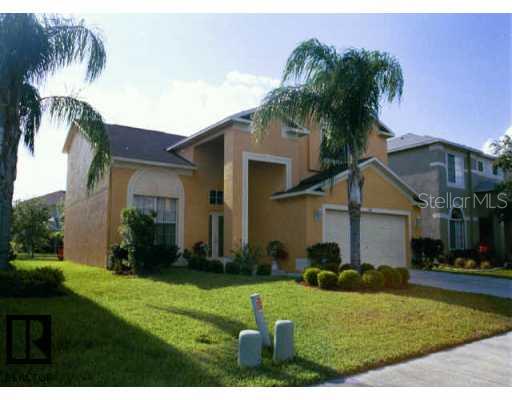 1736 Mapleleaf Boulevard Oldsmar, FL 34677 - Photo 1 of 1 a view of a white house next to a yard with palm trees