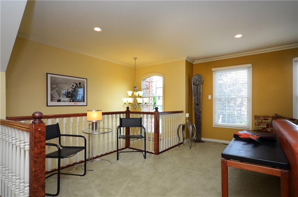 941 Montclair Drive Coraopolis, PA 15108 - Photo 2 of 20 The living room opens into the foyer. It is accented with crown molding.