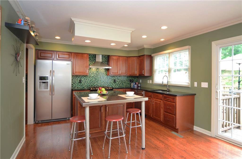 941 Montclair Drive Coraopolis, PA 15108 - Photo 7 of 20 The center island offers a stainless counter with extended eating area.