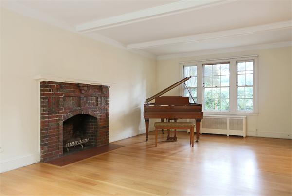 59 Garland Road Newton, MA 02459 - Photo 2 of 6 a living room with furniture and a fireplace