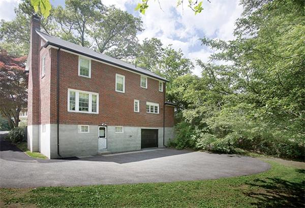 59 Garland Road Newton, MA 02459 - Photo 6 of 6 a front view of a house with a yard and garage