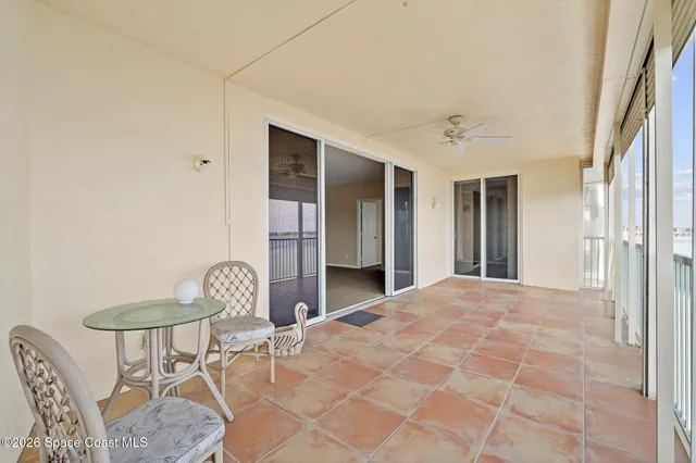 a living room with furniture a table and a potted plant