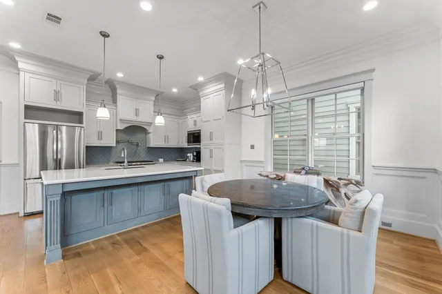 a kitchen that has a sink and a stove