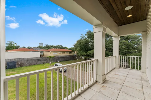 a spacious bathroom with a double vanity sink a large mirror and a bathtub