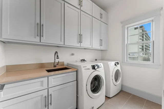 a view of walk in closet with wooden floor