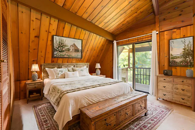 a bedroom with furniture and a window