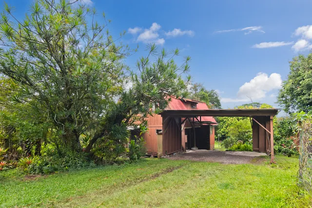 a aerial view of a house with a yard