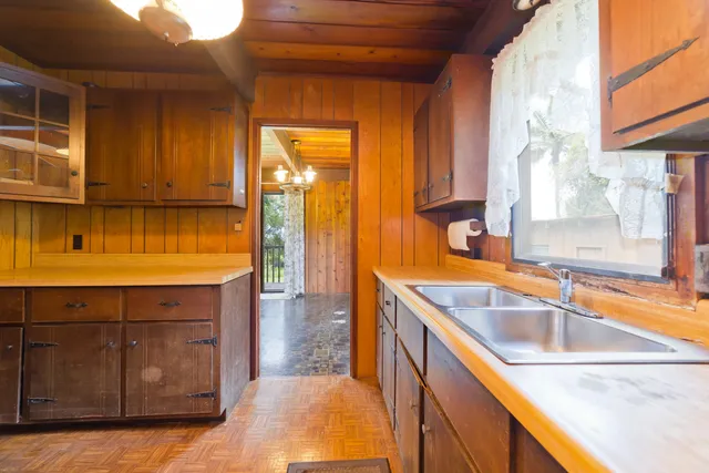 a kitchen with a sink and cabinets