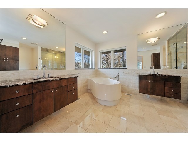 2921 Sheridan Road Evanston, IL 60201 - Photo 23 of 25 a spacious bathroom with a granite countertop tub double vanity and a sink