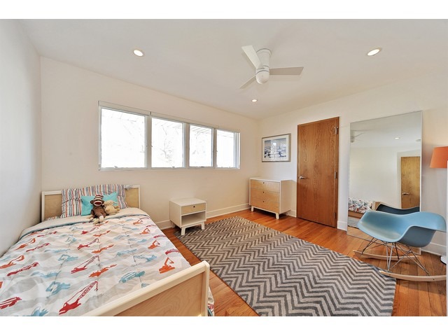 2921 Sheridan Road Evanston, IL 60201 - Photo 25 of 25 a bedroom with a bed and wooden floor