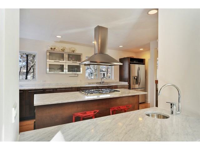 2921 Sheridan Road Evanston, IL 60201 - Photo 9 of 25 a kitchen with stainless steel appliances granite countertop a stove a sink and a refrigerator