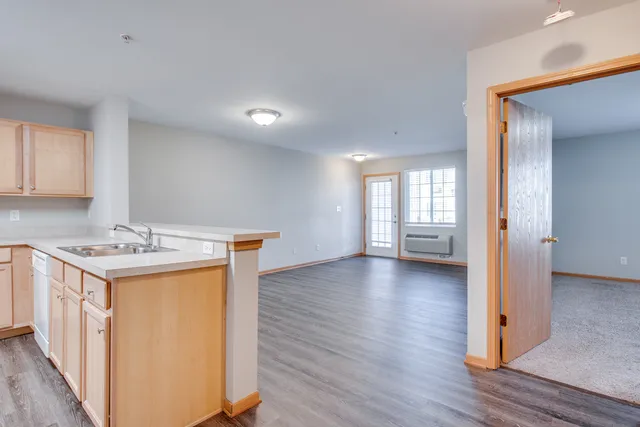 a kitchen that has a sink and a stove in it