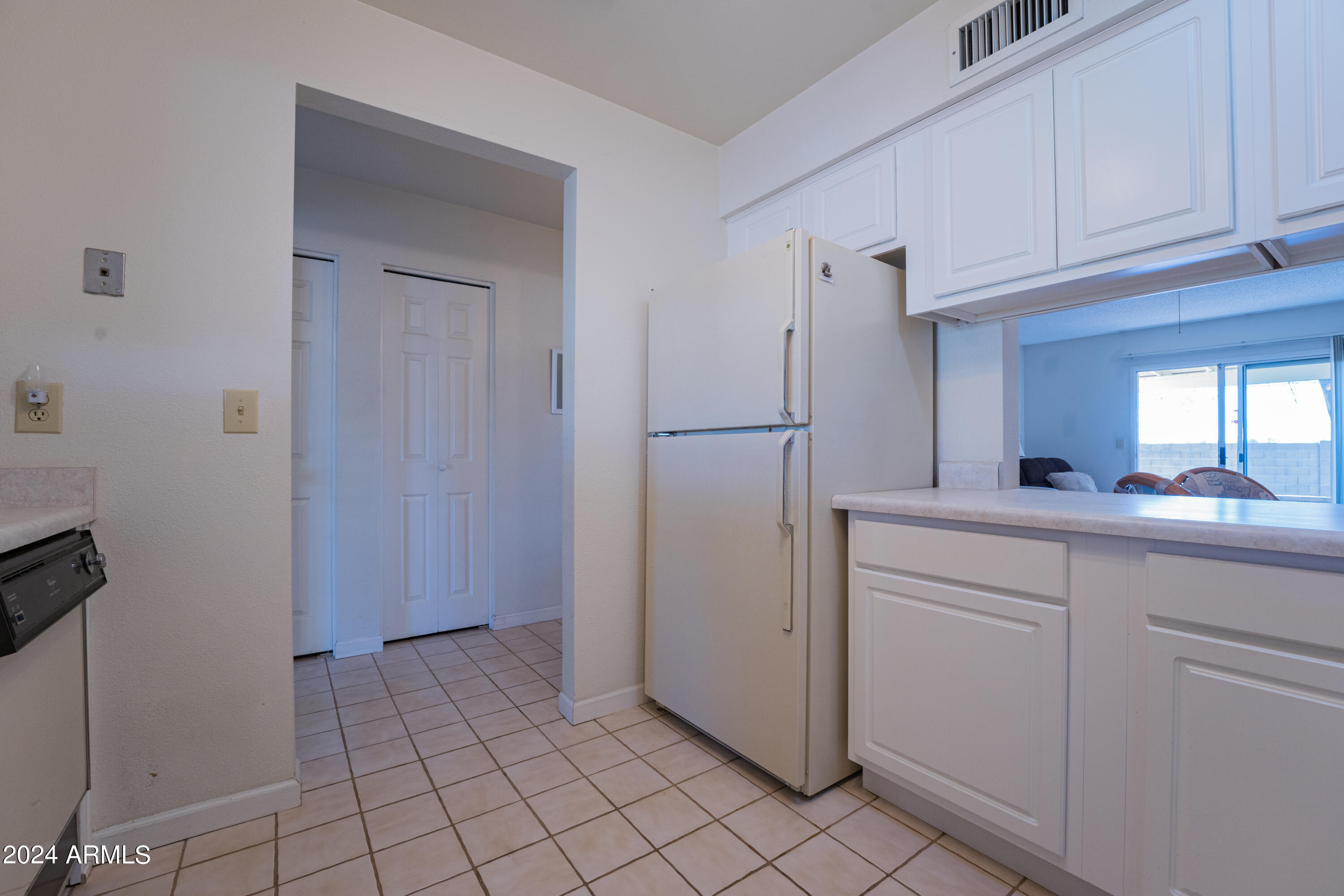 131 North Higley Road, Unit 12 Mesa, AZ 85205 - Photo 11 of 35 Kitchen Entrance w/ Pass Through
