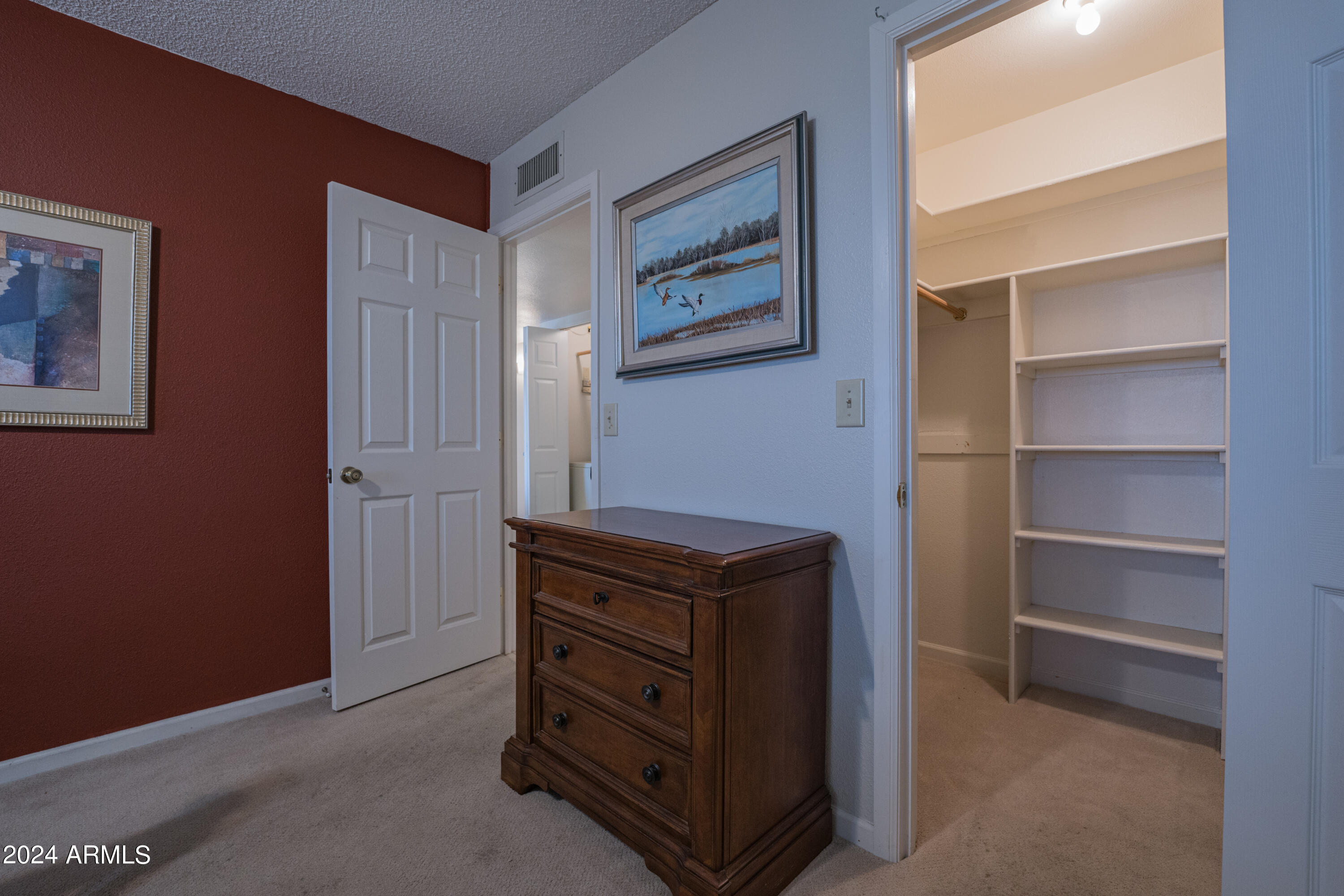 131 North Higley Road, Unit 12 Mesa, AZ 85205 - Photo 21 of 35 Primary Bedroom Walk-in Closet