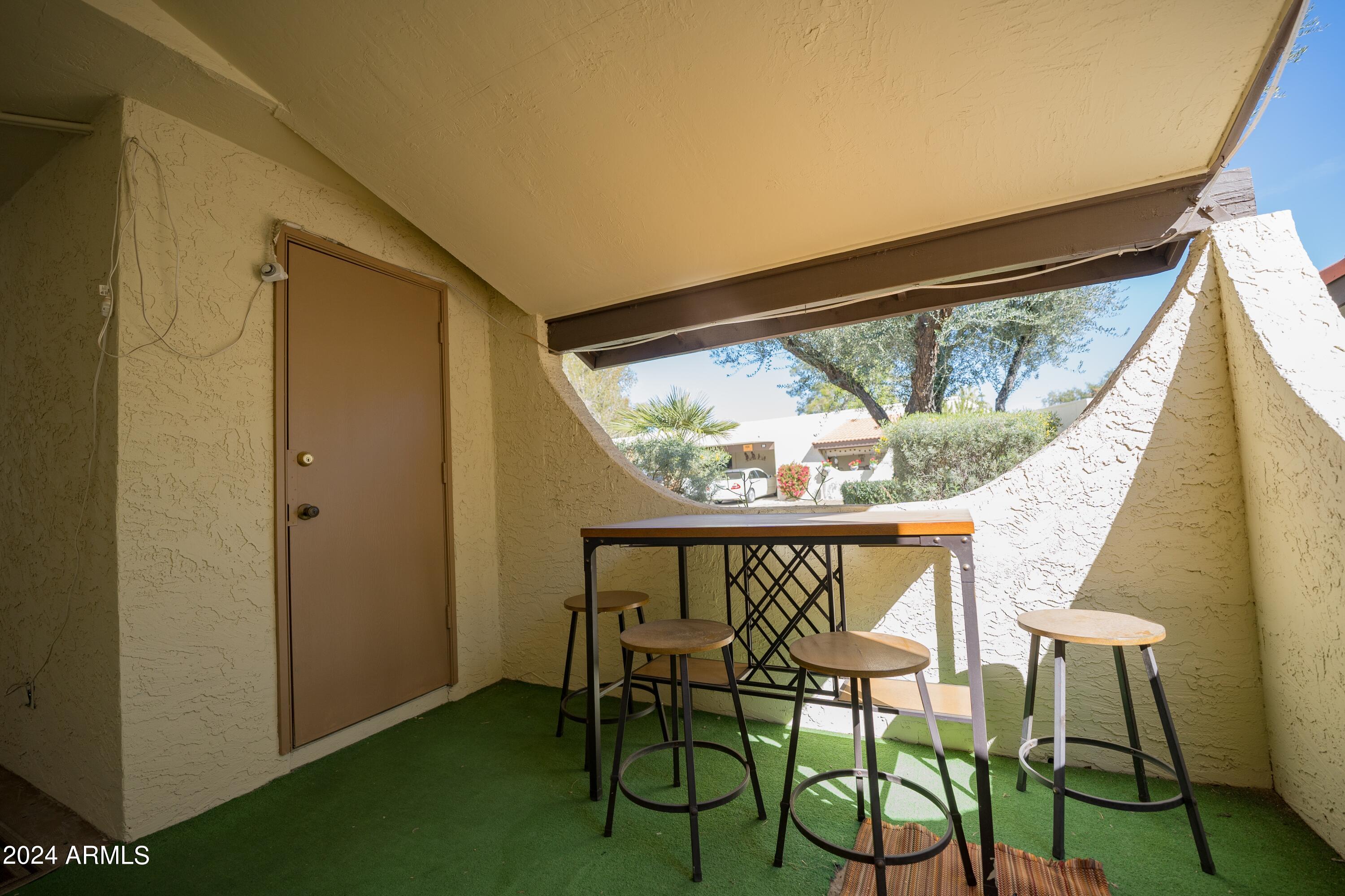 131 North Higley Road, Unit 12 Mesa, AZ 85205 - Photo 31 of 35 Front Covered Patio
