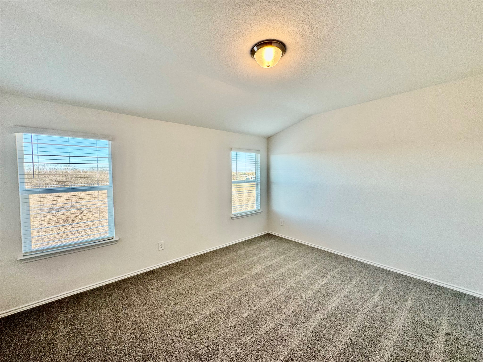 104 Calcite Road, Unit 5 Kyle, TX 78640 - Photo 3 of 21 an empty room with windows