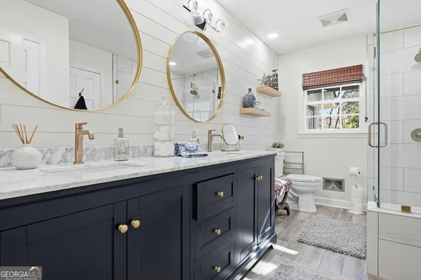 a bathroom with a shower and a sink