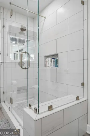 a spacious bedroom with a bed and a window