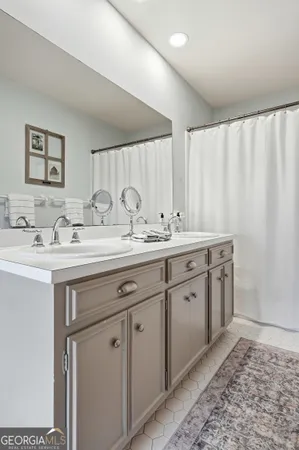 a workspace with wooden floor and a rug
