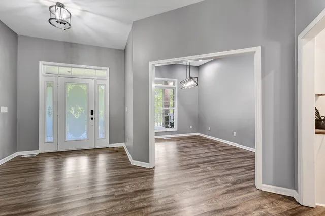 a bathroom with a toilet sink shower and mirror