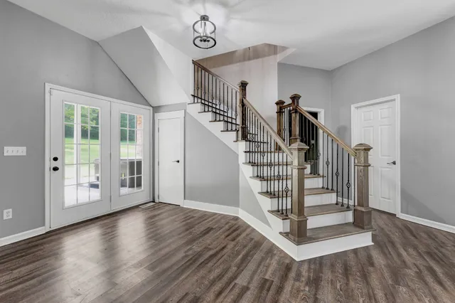 a view of a garden with lawn chairs