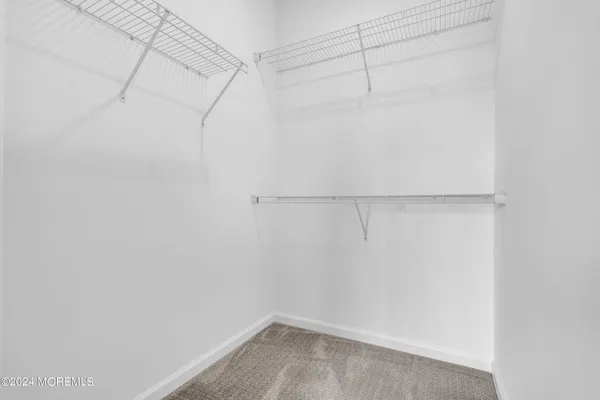 a bathroom with a double vanity sink toilet a mirror and shower