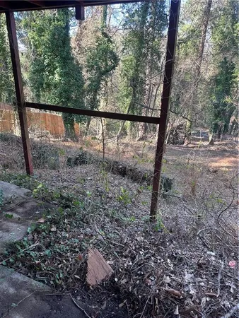 a view of a yard with a tree