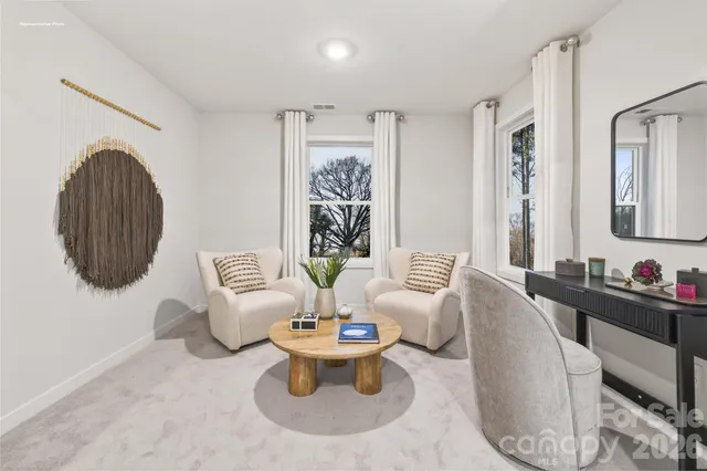 a spacious bedroom with a bed and a window