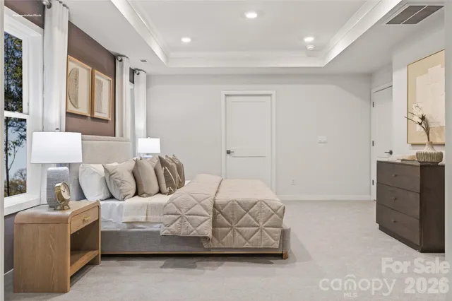 a bedroom with a bed and a cabinets