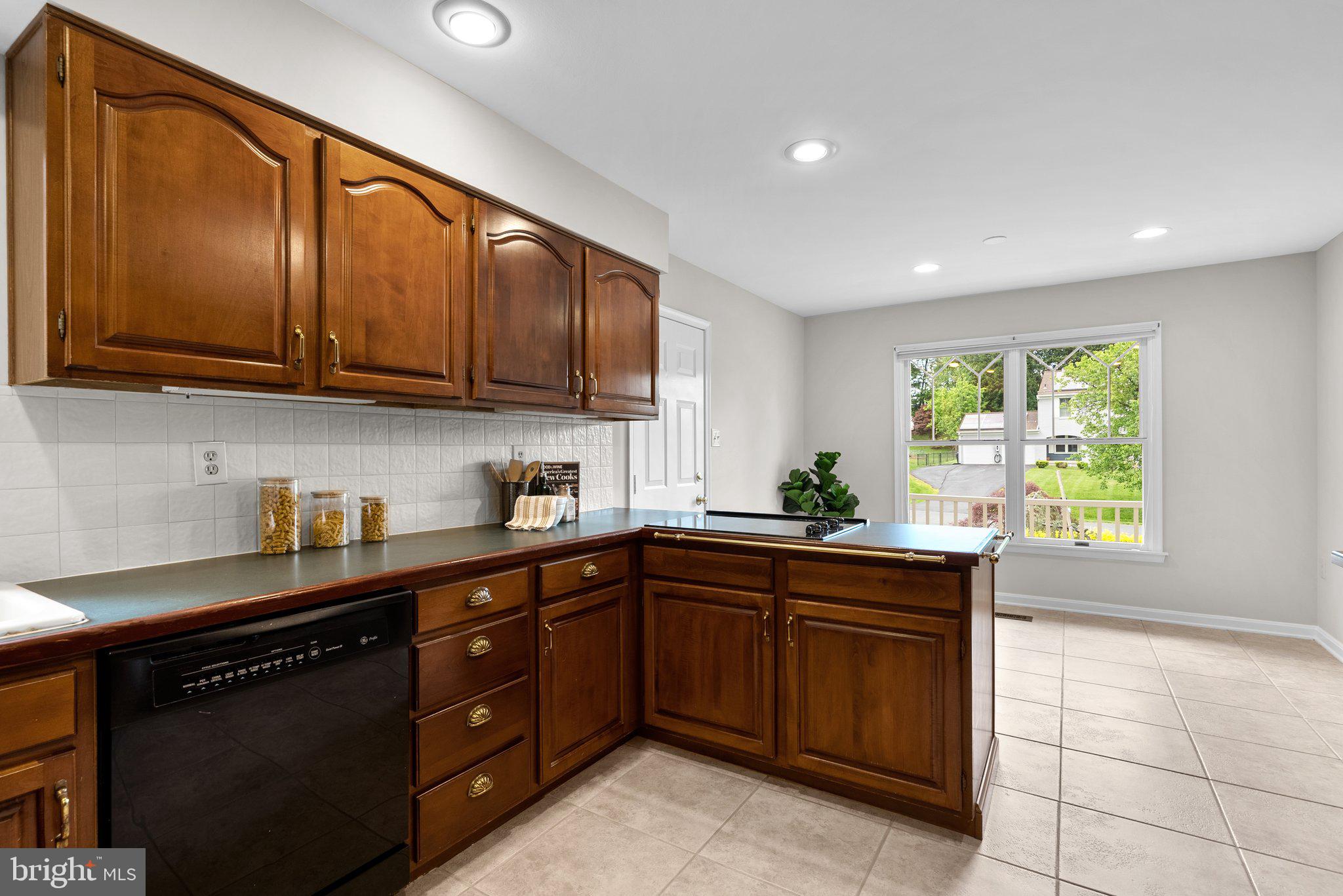14620 Jaystone Drive Silver Spring, MD 20905 - Photo 12 of 52 a kitchen with a sink stove and cabinets