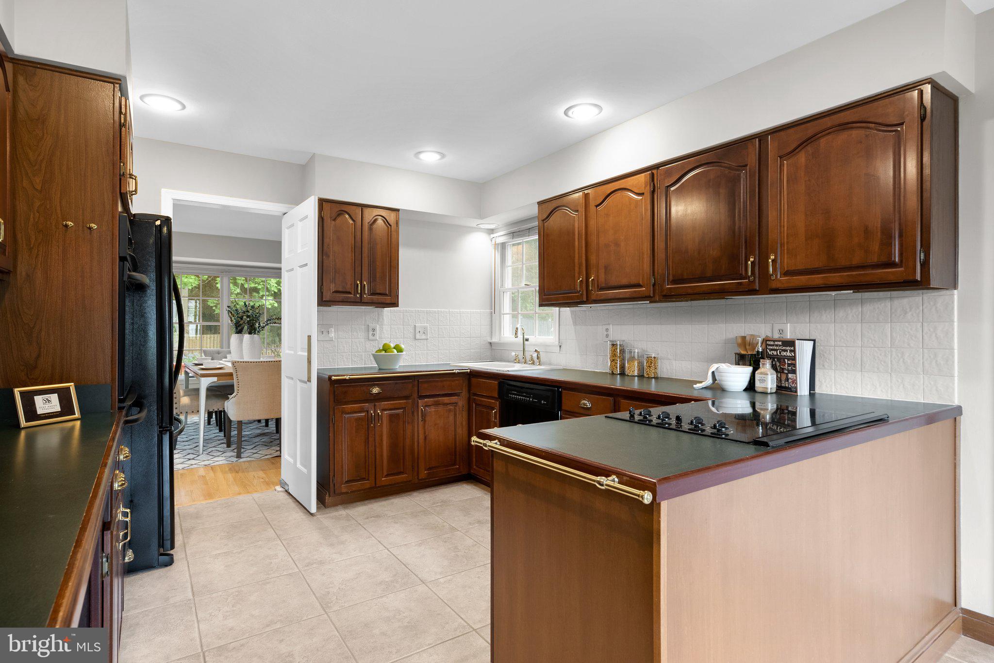 14620 Jaystone Drive Silver Spring, MD 20905 - Photo 13 of 52 a kitchen with stainless steel appliances granite countertop a stove refrigerator sink and cabinets
