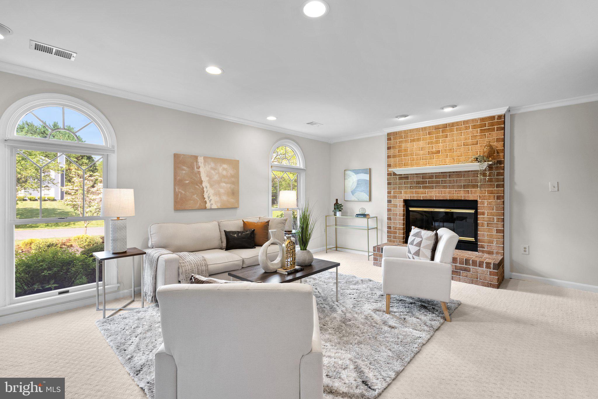 14620 Jaystone Drive Silver Spring, MD 20905 - Photo 17 of 52 a living room with furniture fireplace and a large window