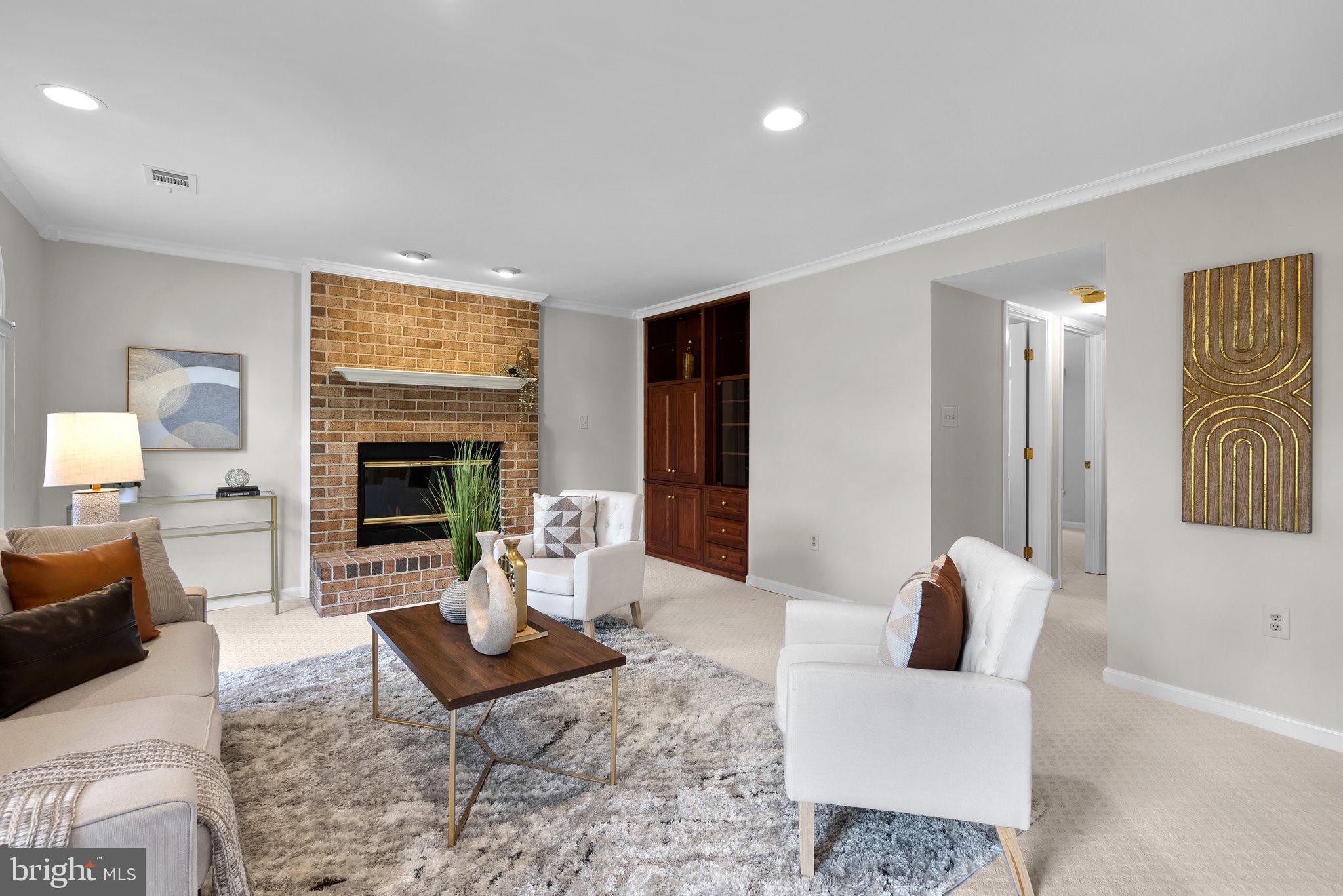 14620 Jaystone Drive Silver Spring, MD 20905 - Photo 18 of 52 a living room with furniture and a fireplace