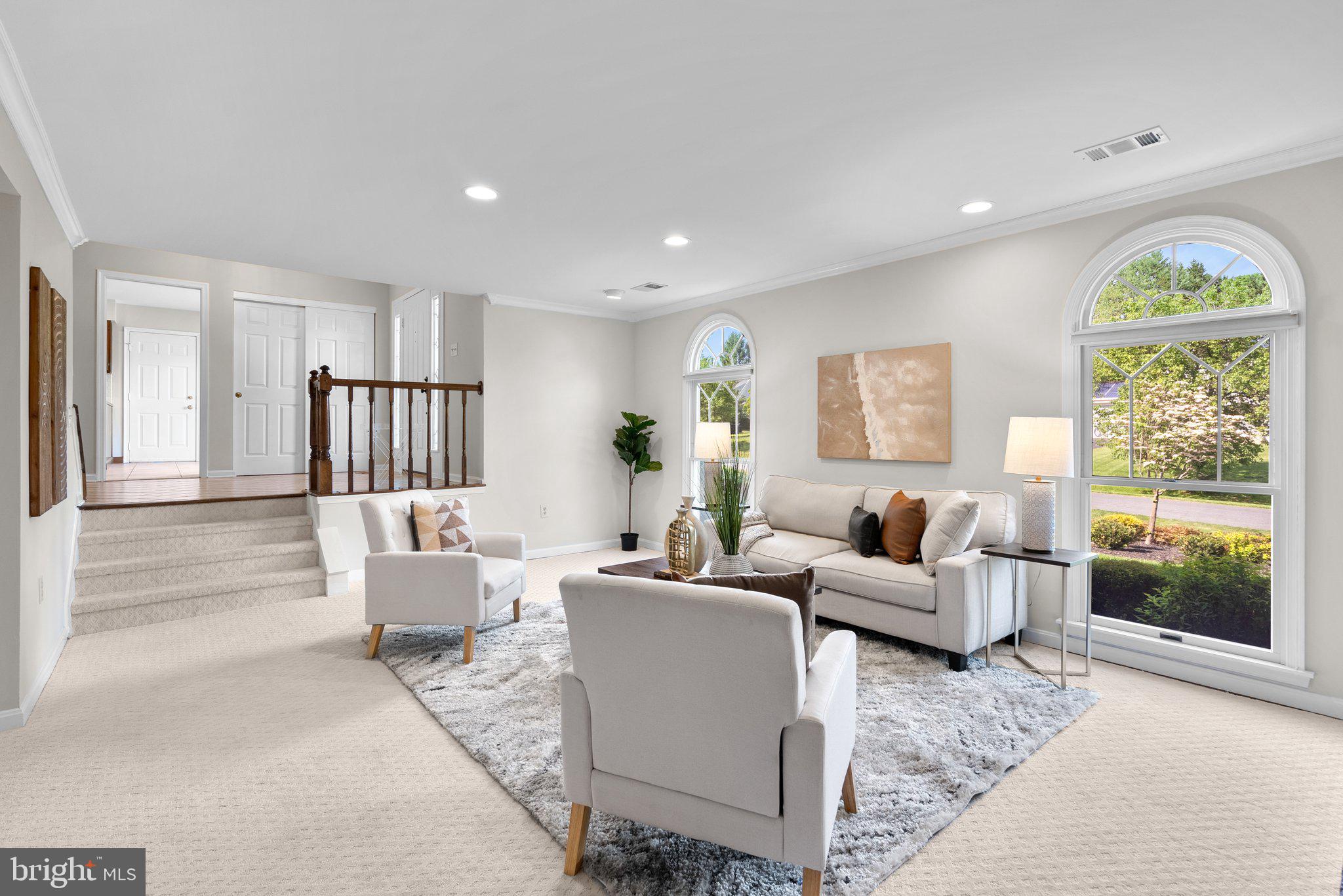 14620 Jaystone Drive Silver Spring, MD 20905 - Photo 19 of 52 a living room with furniture floor to ceiling window and wooden floor