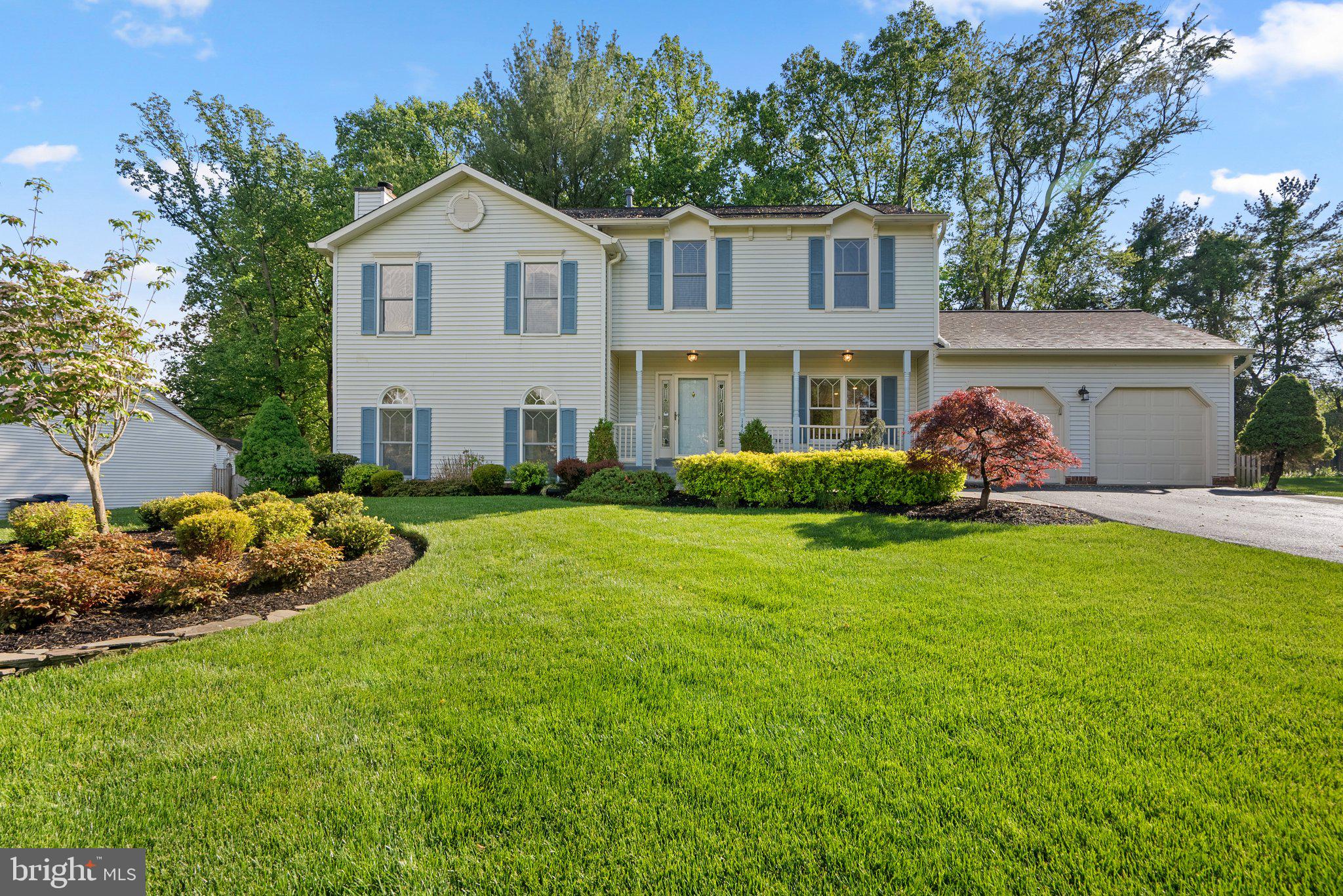 14620 Jaystone Drive Silver Spring, MD 20905 - Photo 2 of 52 a front view of a house with a garden and plants