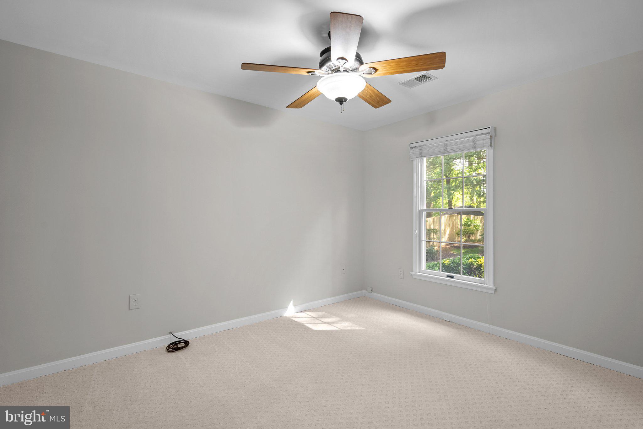 14620 Jaystone Drive Silver Spring, MD 20905 - Photo 21 of 52 an empty room with windows and fan
