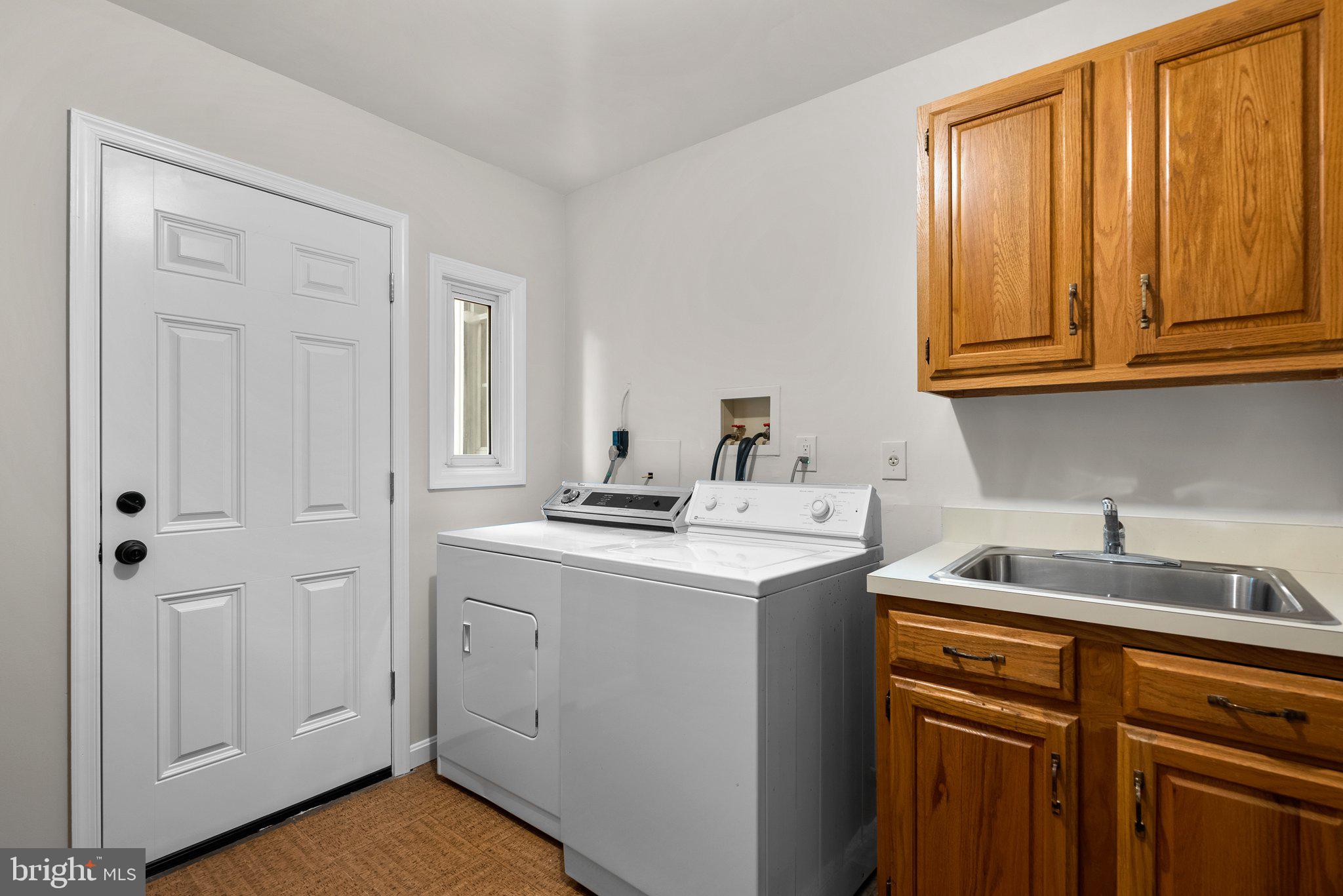 14620 Jaystone Drive Silver Spring, MD 20905 - Photo 23 of 52 a kitchen with a sink cabinets and a window